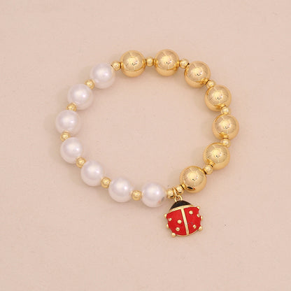 Faux Pearl Beaded Bracelet with Gold Beetle Charm